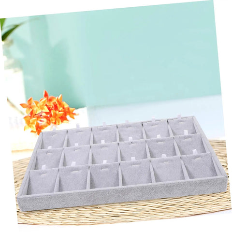 Lowkey Perfect Multi Grid Jewelry Tray For Rings And Necklaces With Smart Dividers on a woven surface with compartments for sorting.