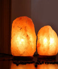 Two glowing Himalayan salt lamps using Replacement 15 Watt Dimmable E12 Salt Lamp Bulb Warm White 1.9 Inch Fit For Himalayan Salt Lamps And Candle Warmers With Long Lasting Performance Value Pack Of 12