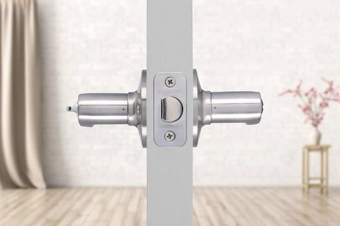 Side view of Six Pack Satin Nickel Privacy Locking Wave Door Levers For Interior Doors, installed on a white door panel.