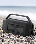 Beast Bluetooth Speaker for Outdoors 100W Peak Power IPX6 Waterproof Boombox with handle on rocky beach