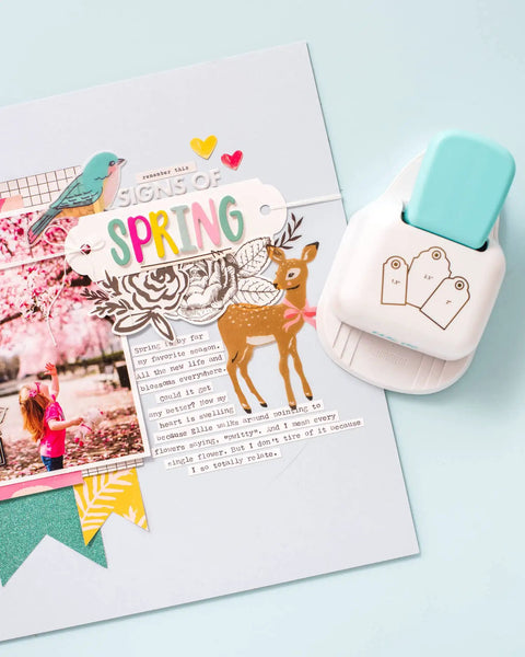 3-In-1 Round Tag Punch for Crafting and Scrapbooking beside a spring-themed scrapbook page