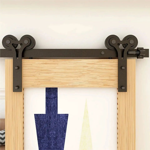 Sliding Barn Door Hardware Kit With Y Shape Rollers And Upgraded Nylon Bearings For Quiet, Smooth Operation, Heavy Duty Track System Delivers Stable And Sturdy Performance For A 5 Foot Door installed on a wood door