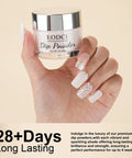 Milk White Nail Dip Powder in a 1 oz jar held in hand, showcasing long lasting manicure finish without UV light.