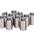 Front view of stainless steel threaded sleeve inserts for thread repair, group of small cylindrical adapters