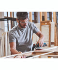 Worker using 18V Brushless 5 Inch Cordless Random Orbit Sander Bare Tool With Ergonomic Palm Grip in workshop setting