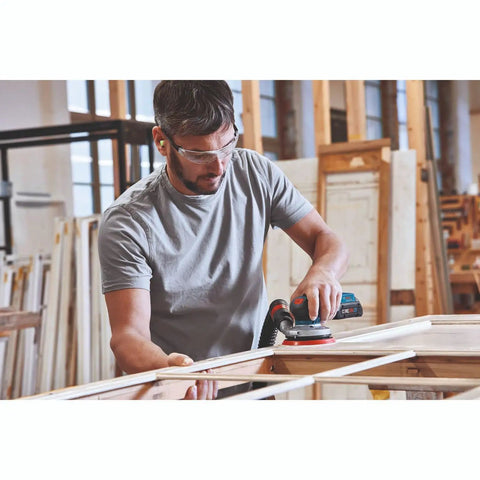 Worker using 18V Brushless 5 Inch Cordless Random Orbit Sander Bare Tool With Ergonomic Palm Grip in workshop setting