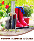 3 Prong Metal Garden Fork For Weeding And Planting Durable Iron Tool with Ergonomic Handle next to garden boots and flowers