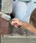 Man using margin trowel from Concrete Starter Tool Kit In Tough Canvas Bag With Six Essential Tools Including Finishing Trowel, Magnesium Hand Float, Stainless Groover, Curved Edger, Wood Float, Margin Trowel, Made In USA CTK2
