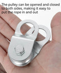 Open Cable Pulley Block With Built-In Bearings For Smooth Lifting, Dual-Sided Opening Design For Easy Rope Insertion, Heavy-Duty Hoist Pulley System, Supports Up To 110 Lb Load, Quick Setup For DIY Lifting Projects, silver metal pulley in hand