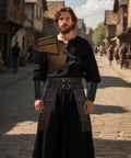 Man wearing Mens Leather Medieval Pauldron Armor Set 8 Piece Viking Knight LARP Ren Faire Cosplay Shoulder Armor in a medieval street