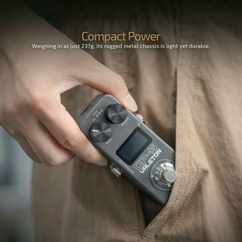 Person holding GP-5 Ultra Compact Multi Effects Processor with NAM IR Loader, small enough to fit in a pocket.