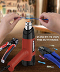 Kickin 1500W Heat Gun Workhorse With Smooth Variable Dial And Dual Airflow Reaching Up To 1200 Fahrenheit being used for heat shrinking wires.