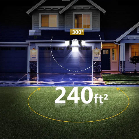 Solar Outdoor Motion Sensor Flood Light With Remote Control illuminating house front and driveway with 300° coverage.