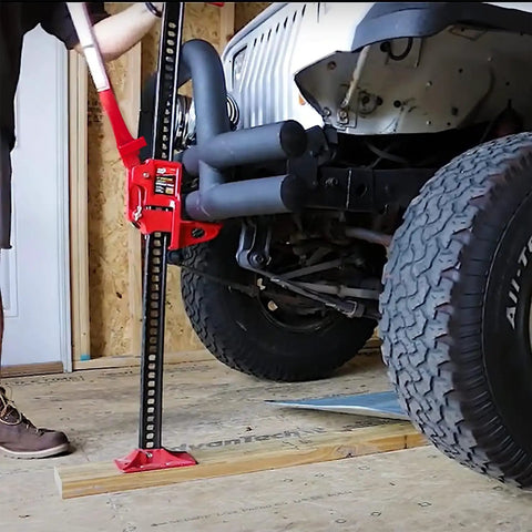 Beefy 48 Inch Ratcheting Off Road Utility Farm Jack, 3 Ton Capacity, lifting vehicle in auto shop, red finish