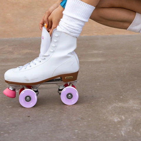 White quad skate with 4 pack roller skate wheels with bearings semi jelly purple for outdoor and indoor quad skates replacement parts.