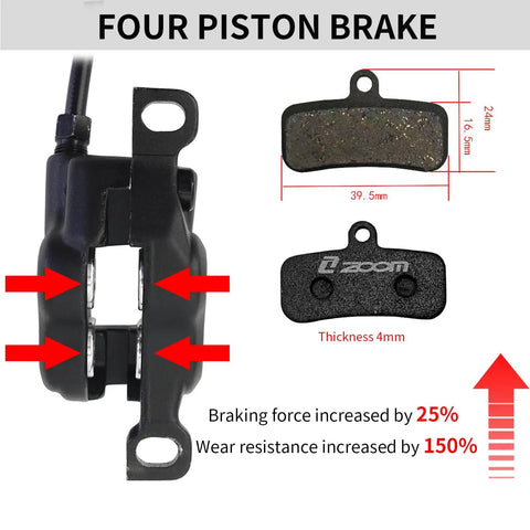 Close-up of Beefy Four Piston Hydraulic Disc Brake Set with 180mm rotors, showing calipers and brake pads dimensions.