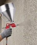 Pro Level Air Spray Gun Kit With Swap Out Three Liter And Six Liter Tanks delivering smooth atomization on textured wall.
