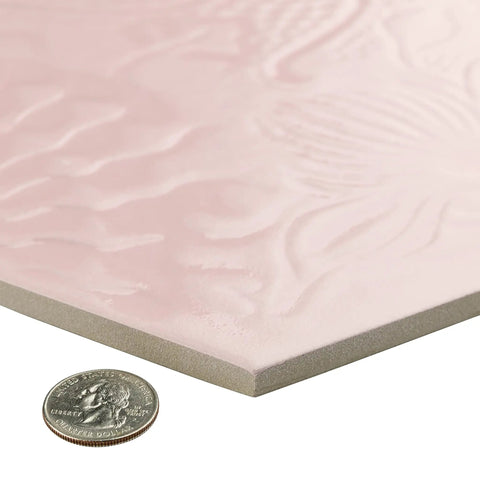 Corner view of hex rose porcelain tile with textured soft pink glaze next to a coin, 8.6 by 9.9 inches, Gaudi Lux style