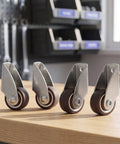 6pcs Rigid Furniture Moving Caster Wheels with Rubber, Silent Mobility on wooden surface, showcasing rubber wheels and metal brackets.
