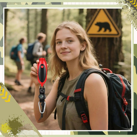 Hiker holding red 125 dB Bear Horn with Compass and Thermometer for hiking and camping in bear warning area