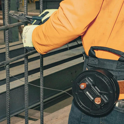 Worker using tie wire reel with quick lock and lightweight aluminum body, ambidextrous rewind knob, fits 12 to 18 gauge wire