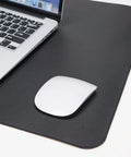 Large Desk Pad 47.2 Inch By 17 Inch Leather Desk Pad Protector With Natural Cork And PU Leather Grippy Non Slip Waterproof Office Mat with a laptop and mouse.