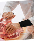 2 Pairs Cut Resistant Arm Sleeves Heavy Slash Proof Arm Guards For Welding Gardening And Mechanic Jobs Built Tough With Breathable PE Mesh in use while cutting meat.