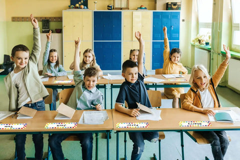 Students in a classroom with 36 Pack Desk Name Plates For Students Classroom Name Tags Vinyl Desk Labels For Kindergarten And Elementary