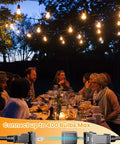 Outdoor LED String Lights 50Ft With 16 Shatterproof S14 Bulbs illuminating backyard dinner party under trees