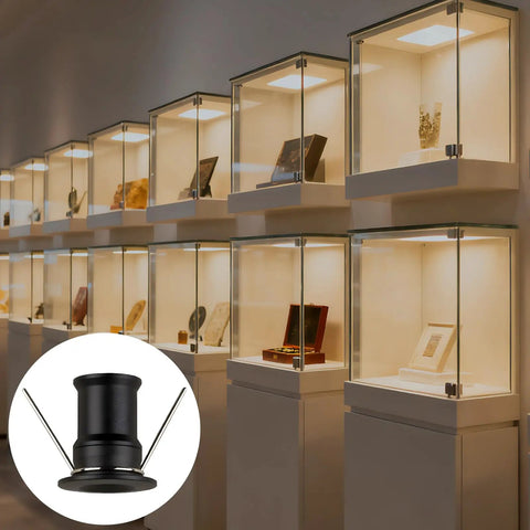 wkao 9 Pcs Led Mini Downlight, 1W DC12V Embedded Spotlight for Cabinets and Showcases in display cases with a warm glow.