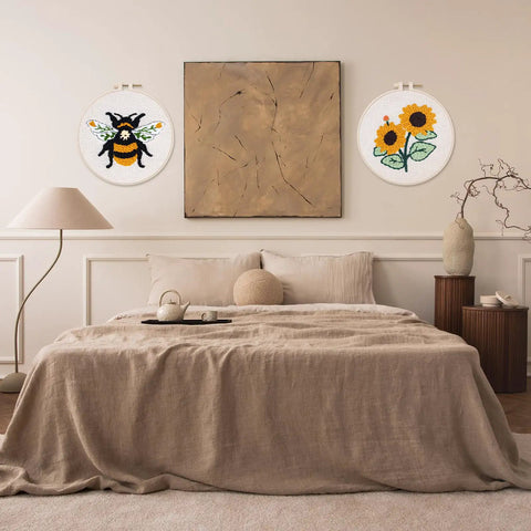 Bedroom wall with bee punch needle art from Chill Dope Beginner Punch Needle Starter Kit With Cute Bee Pattern For DIY Hoop Embroidery