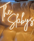 Dope Custom Neon Sign LED Light For Home Bar Wedding Party And Business Use Personalize Your Name Text Or Logo With Dimmable Brightness Backboard Easy Install Unique Gift For Birthday Anniversary Or Corporate Events on beige couch