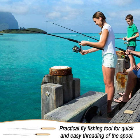 People fishing on a dock with a scenic ocean view, featuring Fly Tying Bobbin Set With Stainless Steel Threader And Ergonomic Handle.