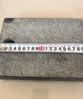 200 By 150 By 40 Millimeter Precision Granite Comparator Base with measuring tape on black granite surface
