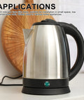 Stainless steel electric kettle with black handle on kitchen counter