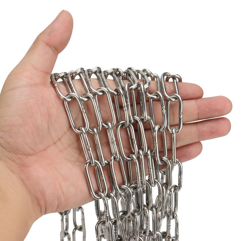 Hand holding Heavy Duty 1/8 Inch By 49 Feet Stainless Steel Coil Chain With Galvanized Polished Finish For Hanging Plants Trailers Clothes Drying And Outdoor Use Strong Load Bearing Metal Link Chain For Everyday DIY Tasks