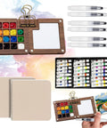 Mini Watercolor Travel Kit With Wooden Palette And Copper Clip Includes 24 Watercolors 6 Brushes And 2 Sketchbooks For Beginners And Painting Enthusiasts On The Go; palette, paints, brushes, sketchbooks displayed.