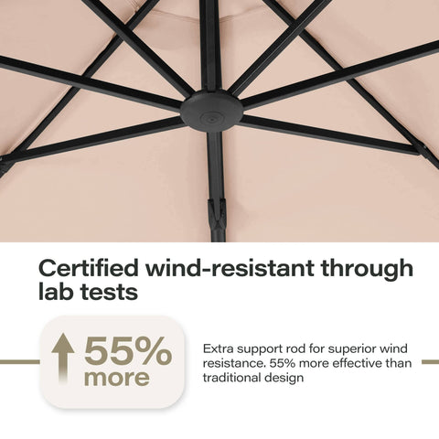 Close-up view of the 11 Ft Deluxe Cantilever Outdoor Umbrella with base, showcasing robust wind-resistant support rods in beige.