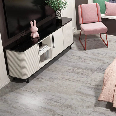 Living room with 32 Pack Peel And Stick Vinyl Floor Tiles 12x12 Inch Waterproof Removable Sheet Flooring For Kitchen Bathroom Basement Retro Laminate Look Easy Self Adhesive Install Renters Friendly featuring grey tones next to a modern TV stand and chair.