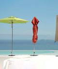 Beefy Heavy Duty Patio Umbrella Cover for 7 to 9 Foot Parasols, Waterproof 12 Oz PVC Coated Polyester, Beige on a patio.