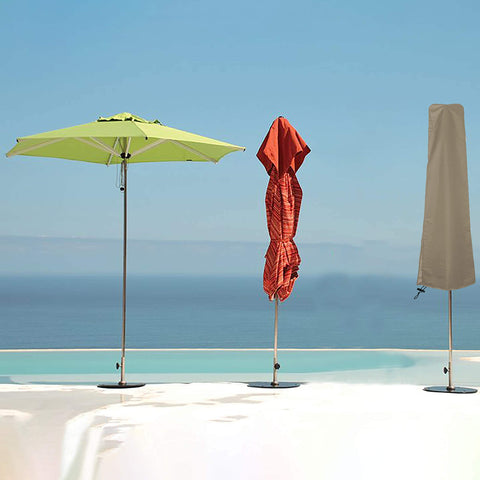 Beefy Heavy Duty Patio Umbrella Cover for 7 to 9 Foot Parasols, Waterproof 12 Oz PVC Coated Polyester, Beige on a patio.