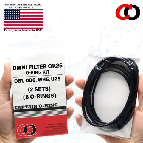 Hands holding OK25 Replacement O Ring Kit for OmniFilter OB1 OB6 WH5 U25 Water Filter Housings, includes packaging and o-rings.