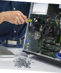 Person using 100Pcs Eyeglass Repair Screws Kit For Quick Eyewear Fixes near open computer case and scattered screws.