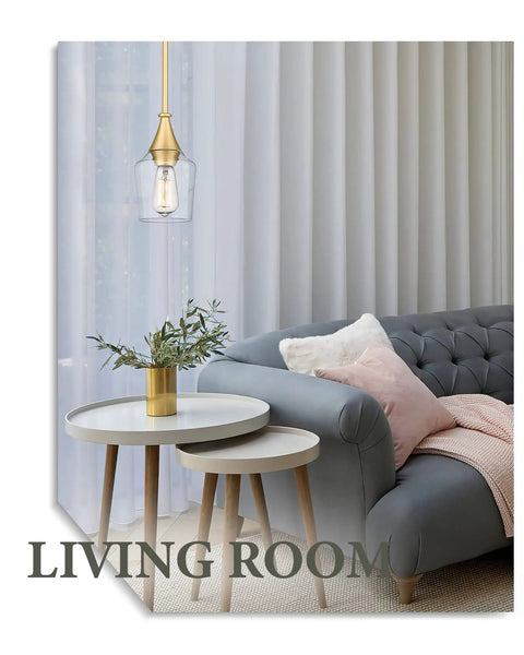Gold Pendant Light With Clear Glass Shade Adjustable Height Modern Hanging Fixture in a cozy living room setting