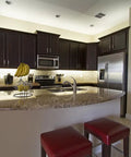 Modern kitchen with 12V Hardwire Kitchen Light Kit With Dimmable LED System 4000K Pure White Under Cabinet Lighting illuminating countertops.