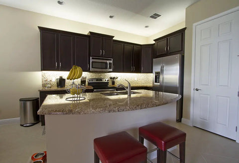 Modern kitchen with 12V Hardwire Kitchen Light Kit With Dimmable LED System 4000K Pure White Under Cabinet Lighting illuminating countertops.