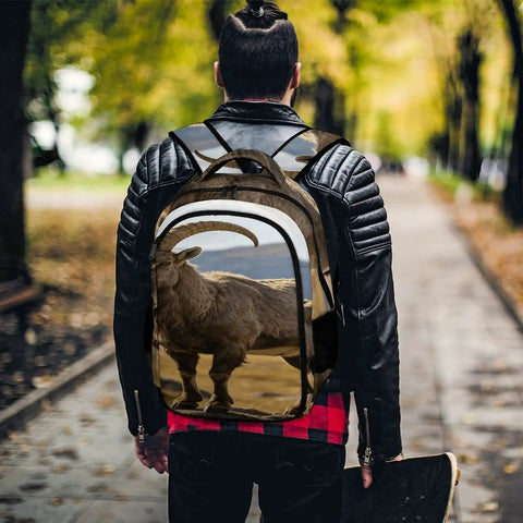 Alpine Wild Horned Goat Print Backpack for Unisex Large Capacity Daypack worn by person in leather jacket on a tree-lined path.