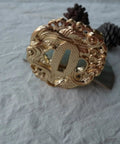Hand Forged Alloy Katana Tsuba Guard For Samurai Swords 3.2 Inch Durable Iaido Accessory with ornate fish pattern on display