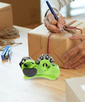 ProLevel Semi Automatic Heat Transfer Tape Dispenser Multi Roll Packing Stand With Precision AutoCut Blade For Fast Shipping, green color with tape roll and cutting blade.