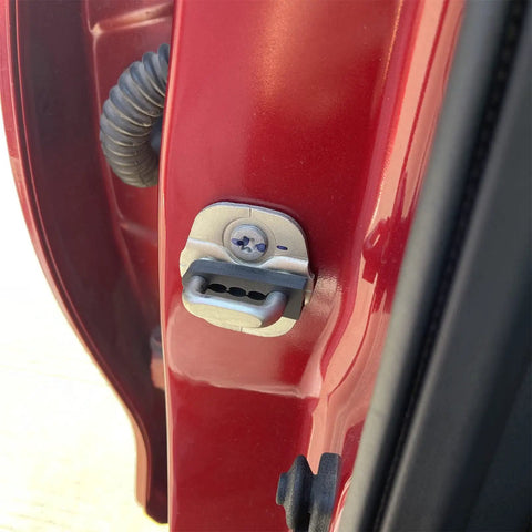 Close-up of a car door lock, showcasing the installation point for Premium Sound Damper Door Lock Buffers To Beat Rattling And Shut Up Squeaky Knocks From Car Doors Plus Silent Strike Pads Kill Vibration And Hush Impact Noise For A Chill Ride On Bumpy Roads In Nissan Cars.